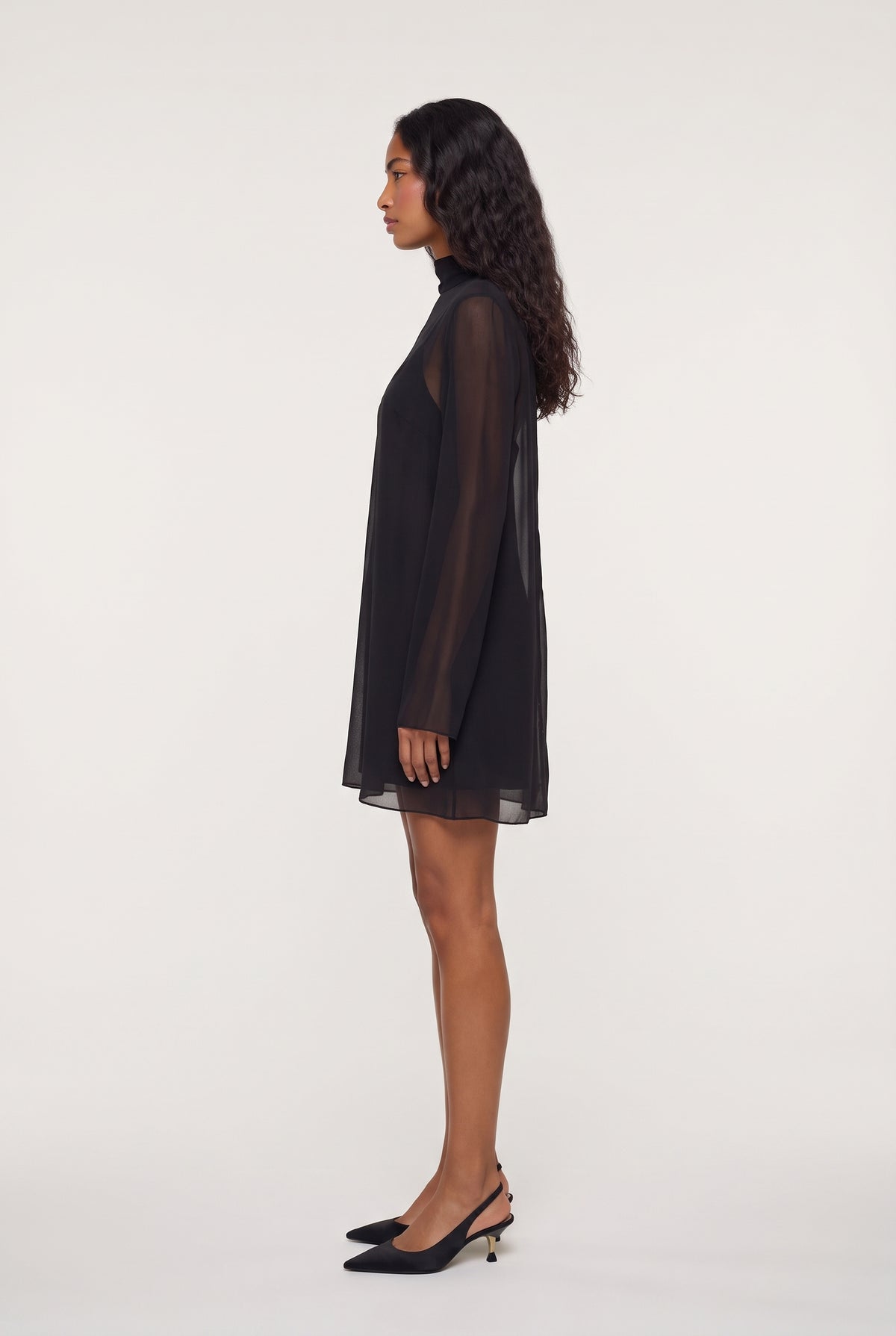 
model wearing Leo Turtleneck posing Side View