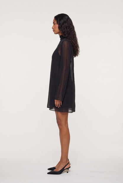 
model wearing Leo Turtleneck posing Side View