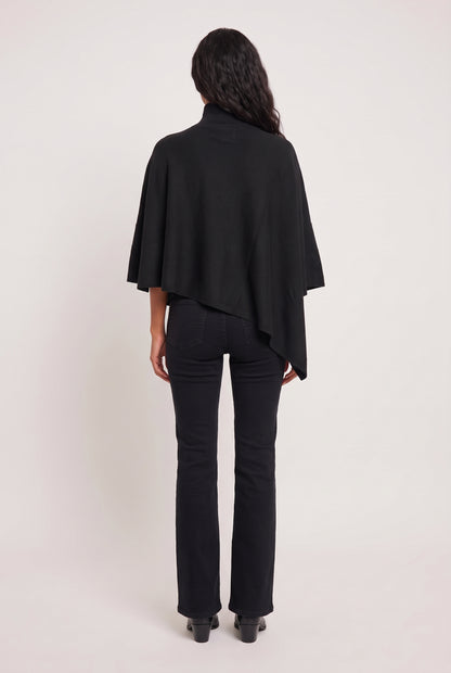 
model wearing Tiwa Cape posing Back View