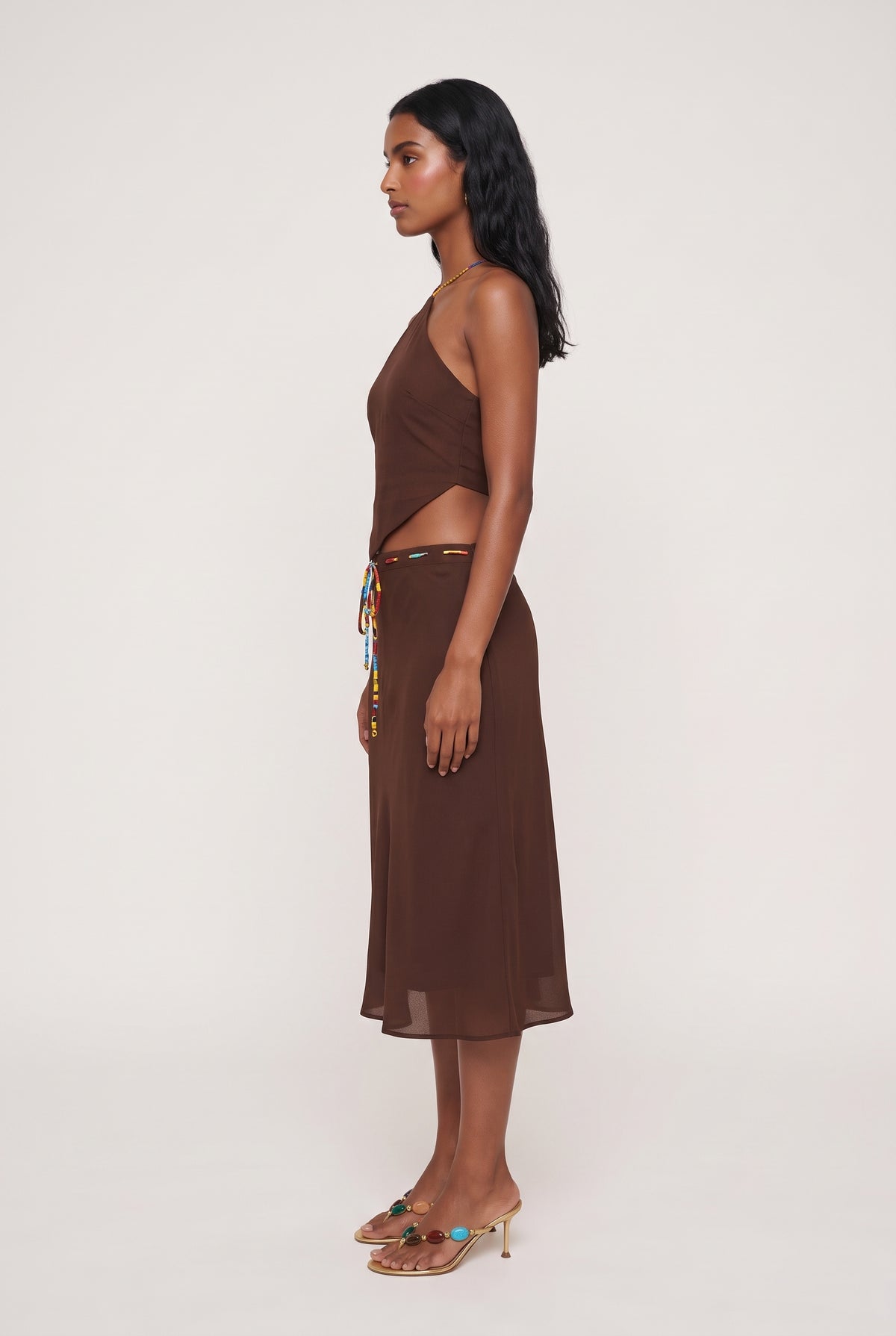 
model wearing Demi Halter Top posing Side View
