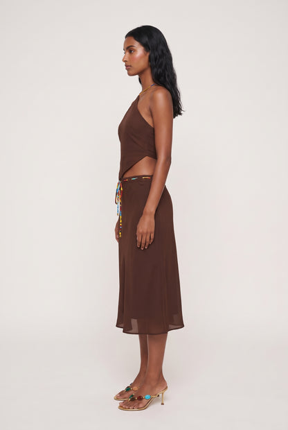 
model wearing Demi Halter Top posing Side View