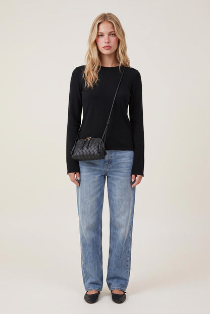 
model wearing Woven Crossbody Bag posing Front View