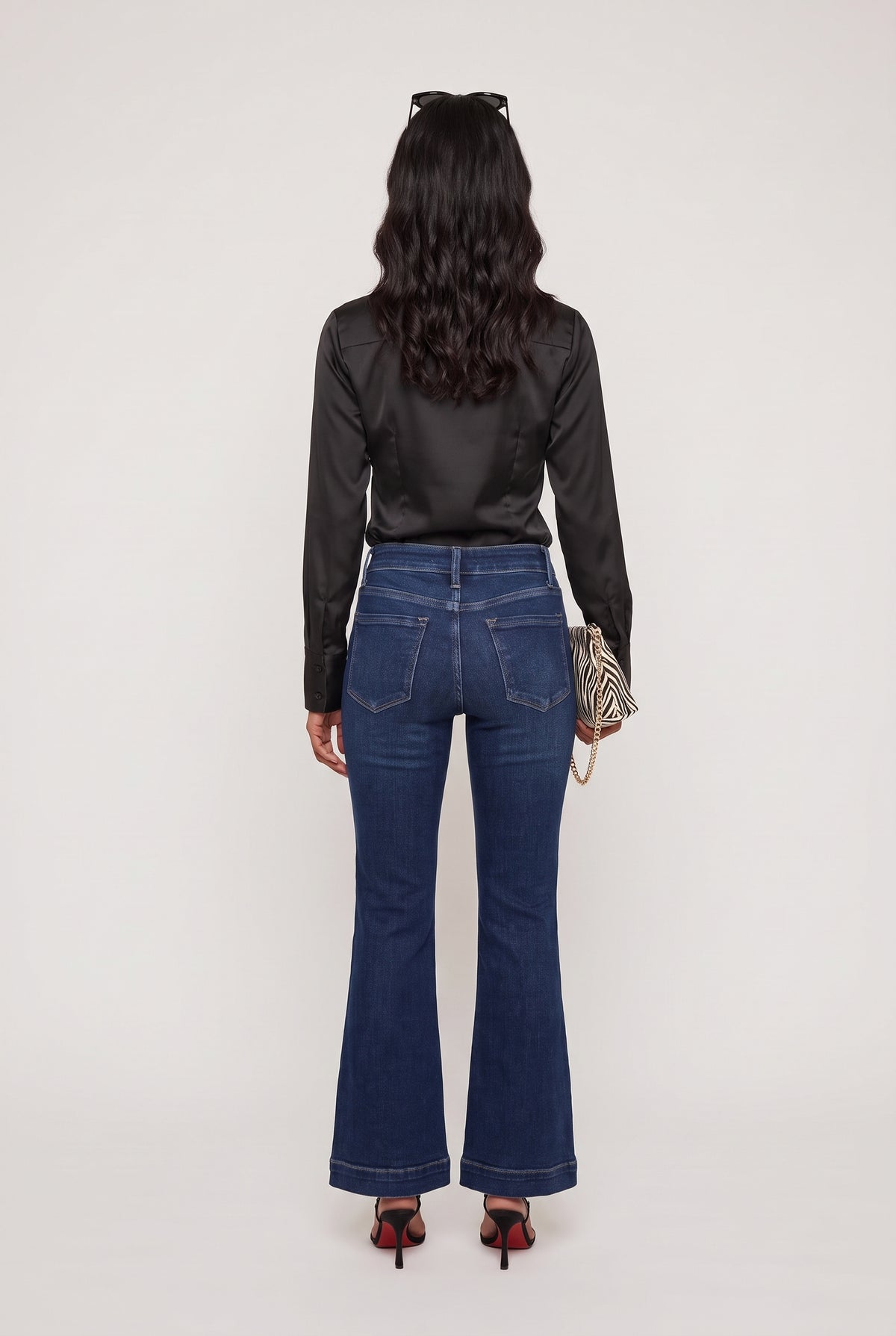 
model wearing Mid Rise Dark Flare posing Back View
