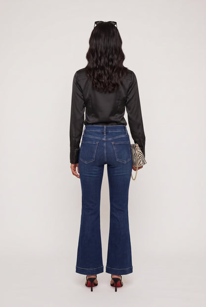 
model wearing Mid Rise Dark Flare posing Back View