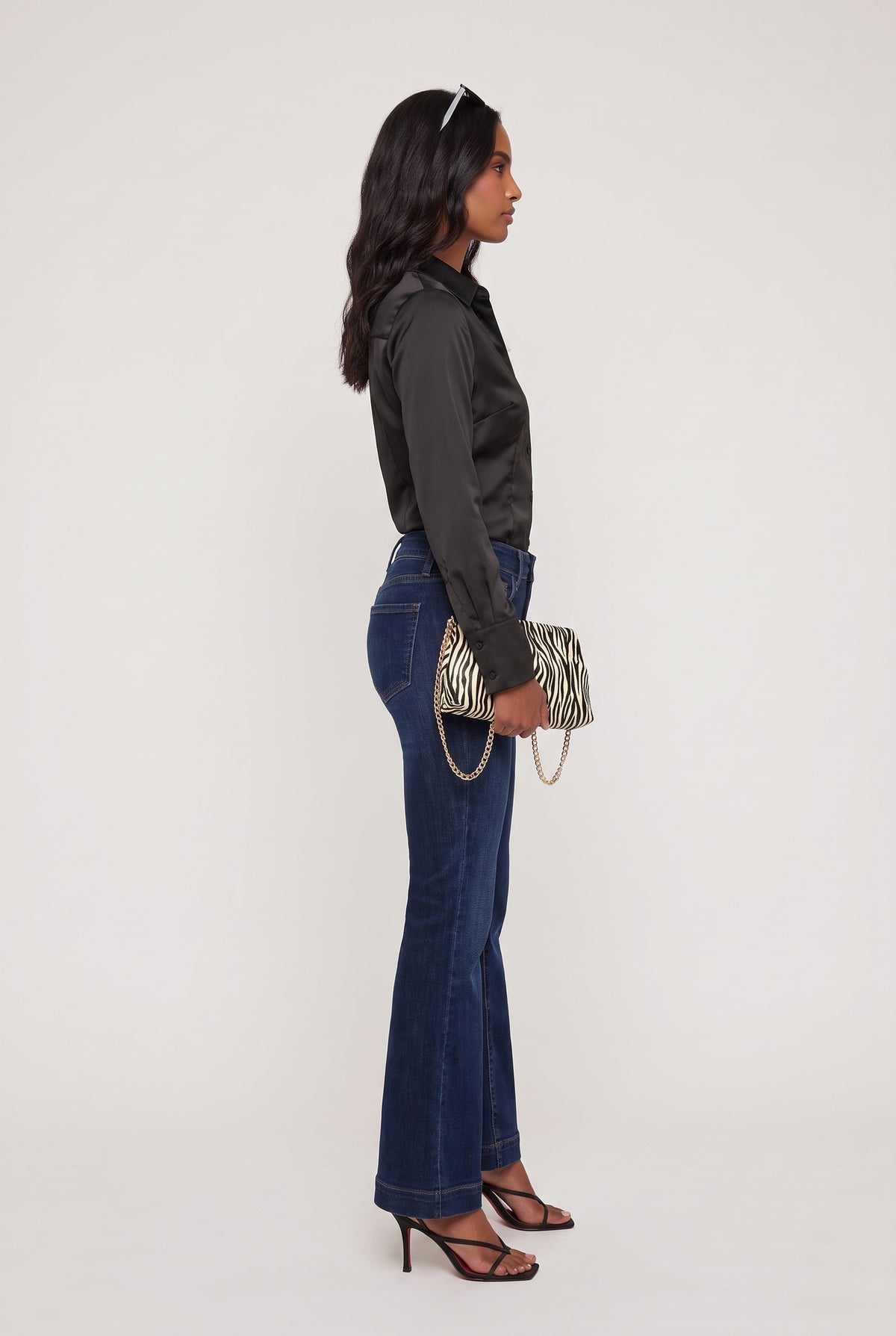 [DENIM] model wearing Mid Rise Dark Flare posing Side View