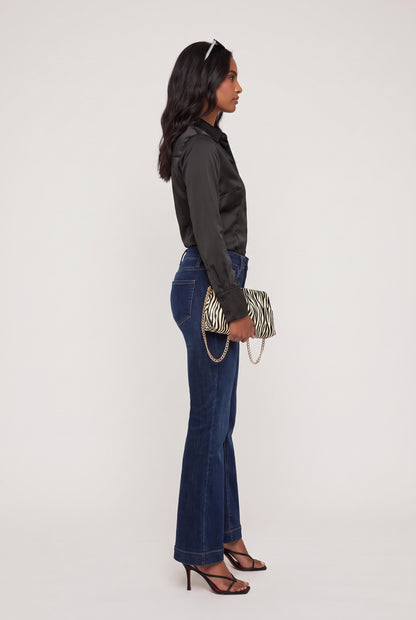 
model wearing Mid Rise Dark Flare posing Side View