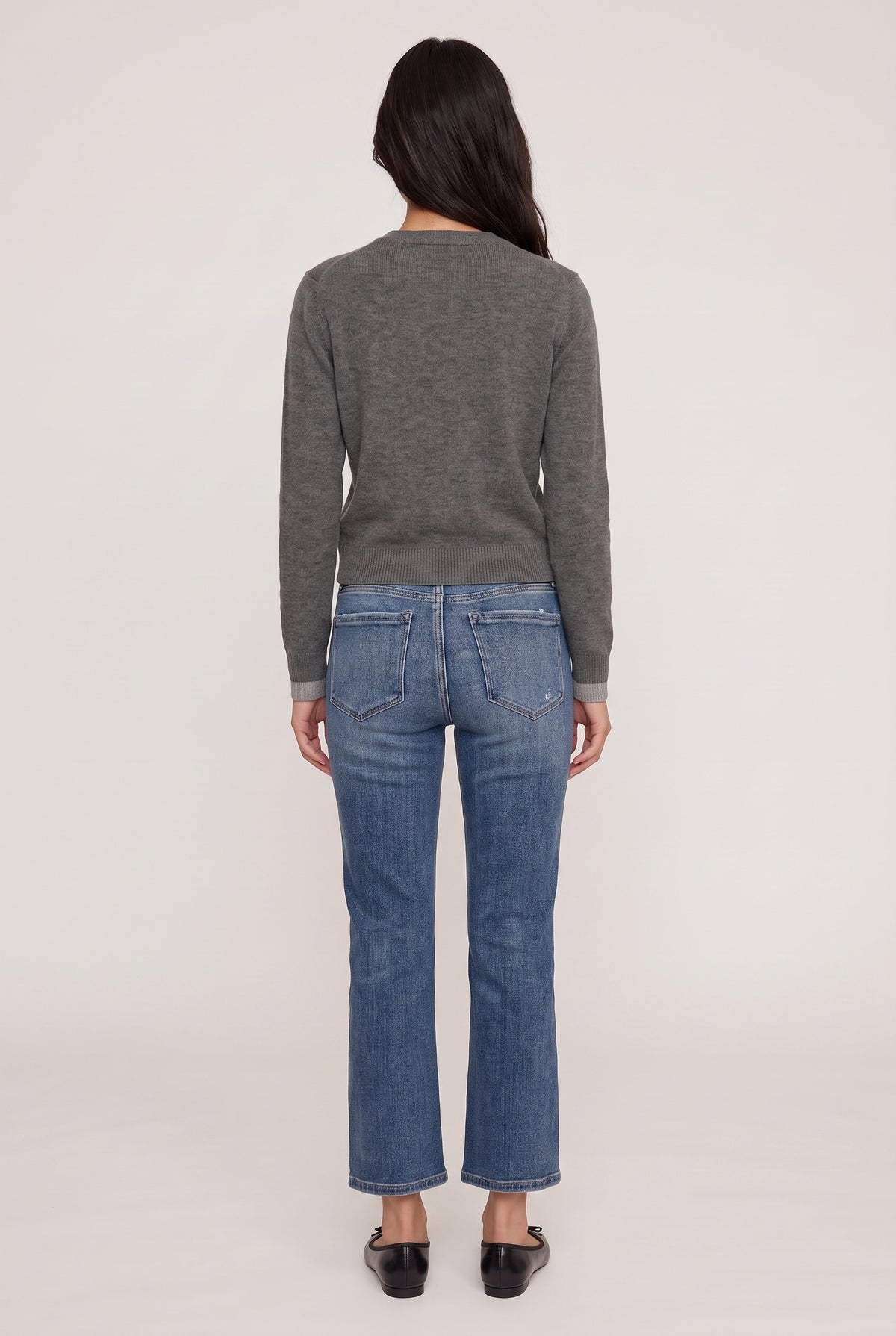 [DENIM] model wearing Mid Rise Slim Straight posing Back View
