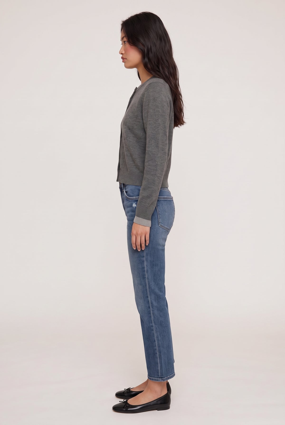 
model wearing Mid Rise Slim Straight posing Side View