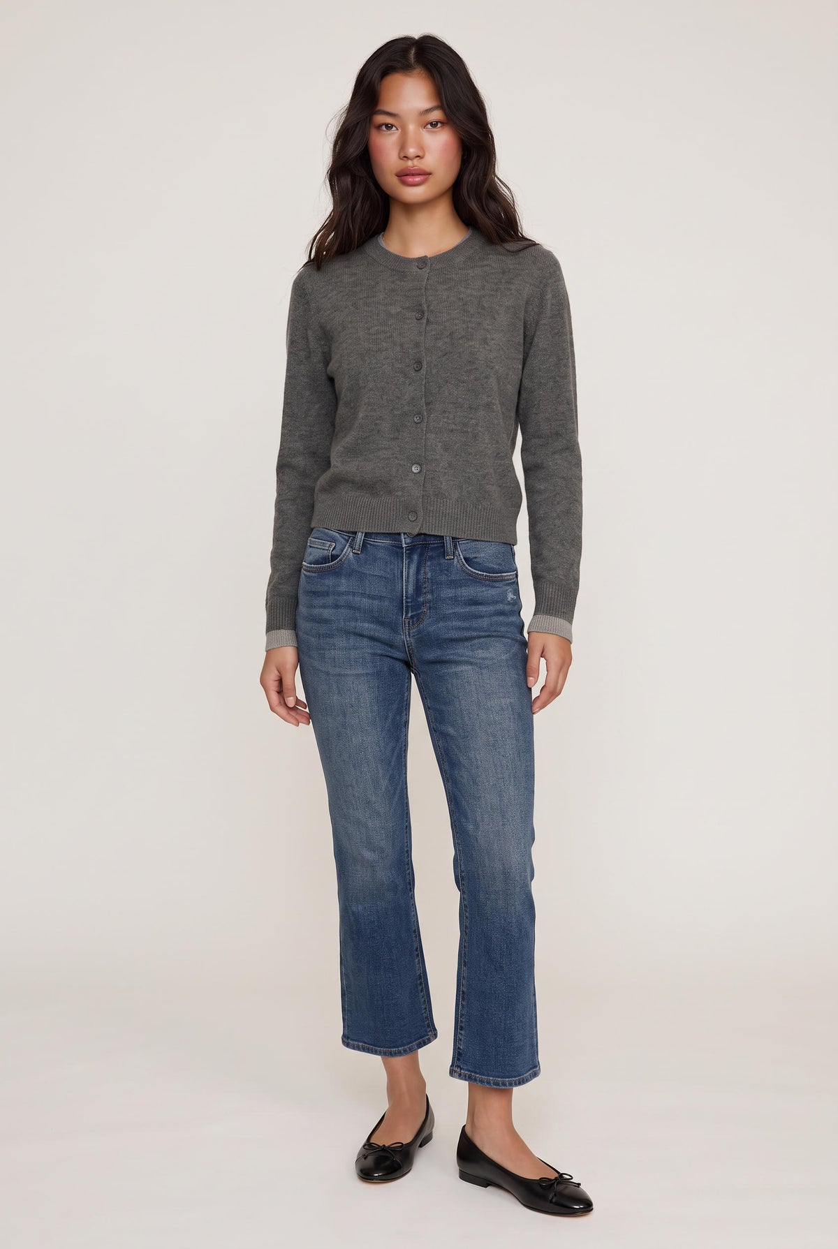 [DENIM] model wearing Mid Rise Slim Straight posing Front View