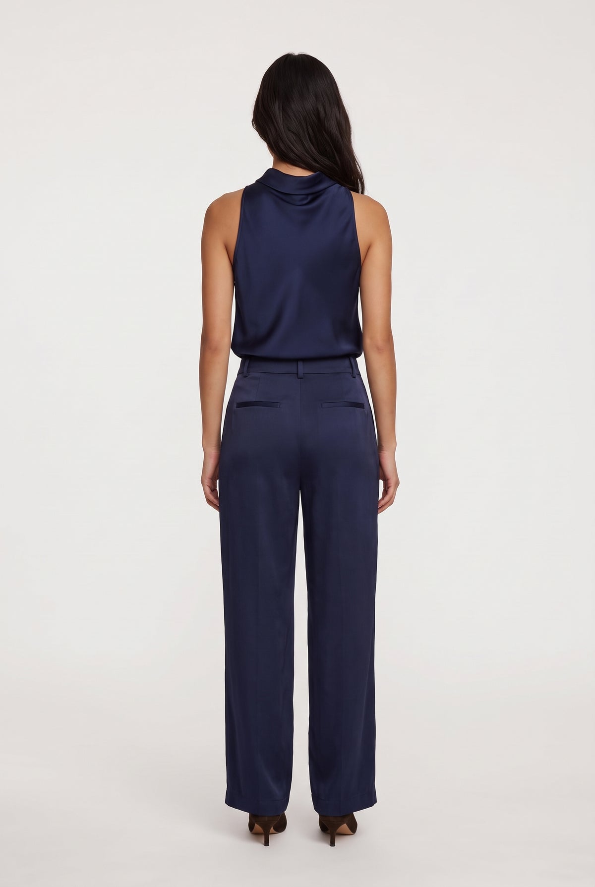 
model wearing Aman Satin Tank posing Back View