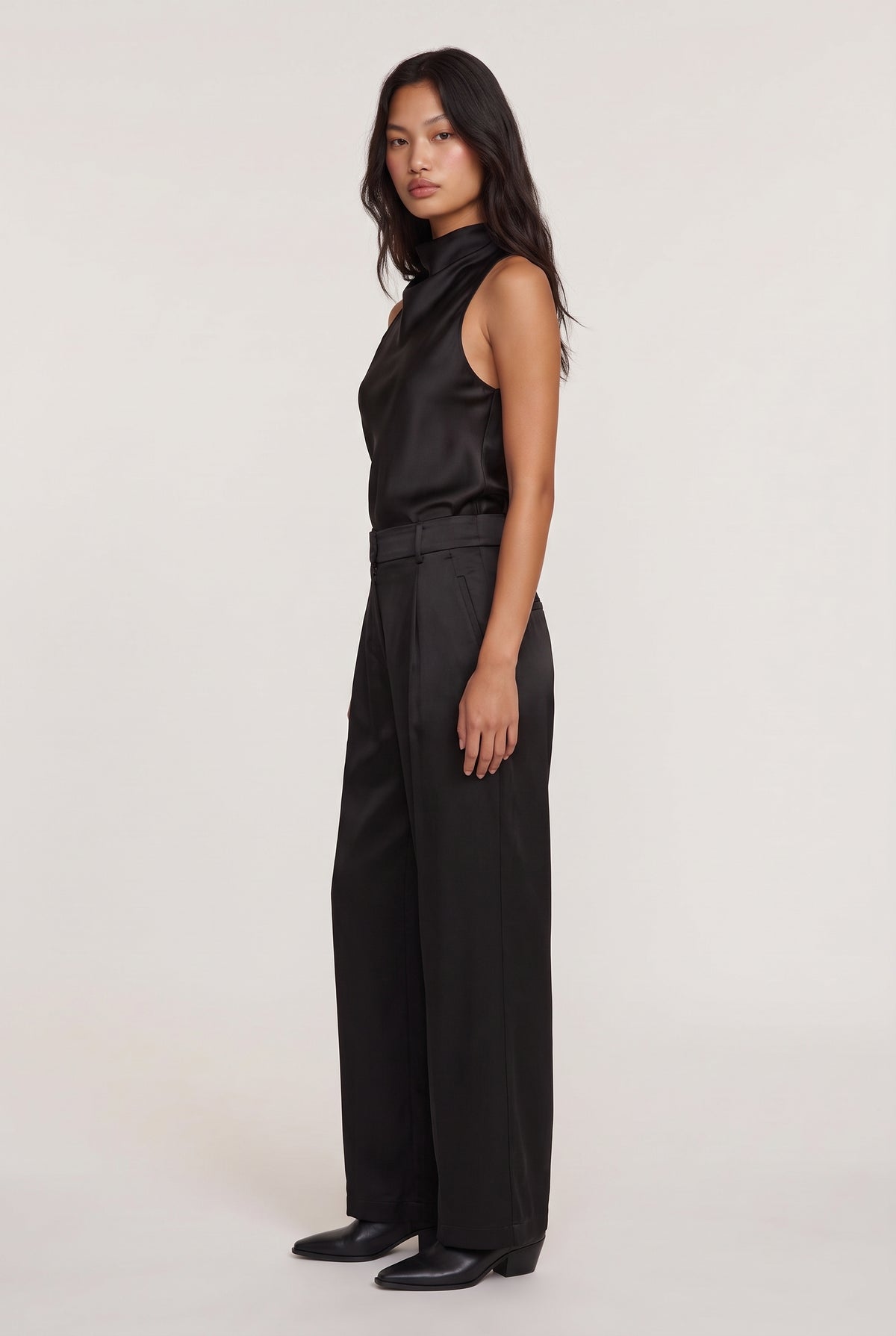 
model wearing Aman Satin Trouser posing Side View