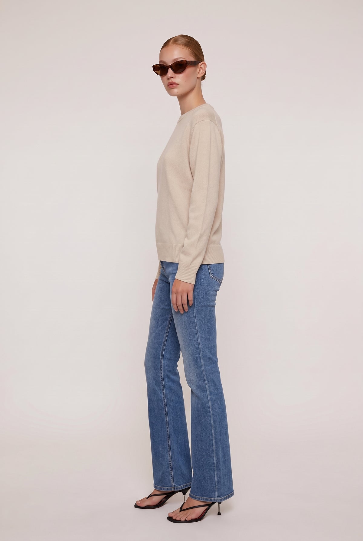 
model wearing Classic 100% Cashmere Crew posing Side View