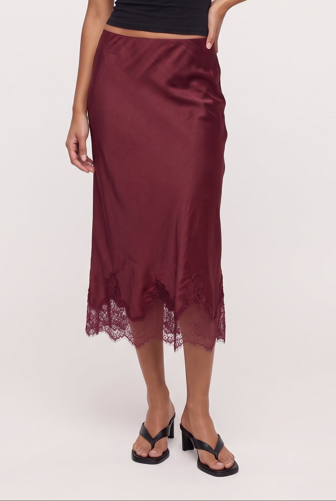 
model wearing LUCIA LACE SLIP SKIRT posing Front View
