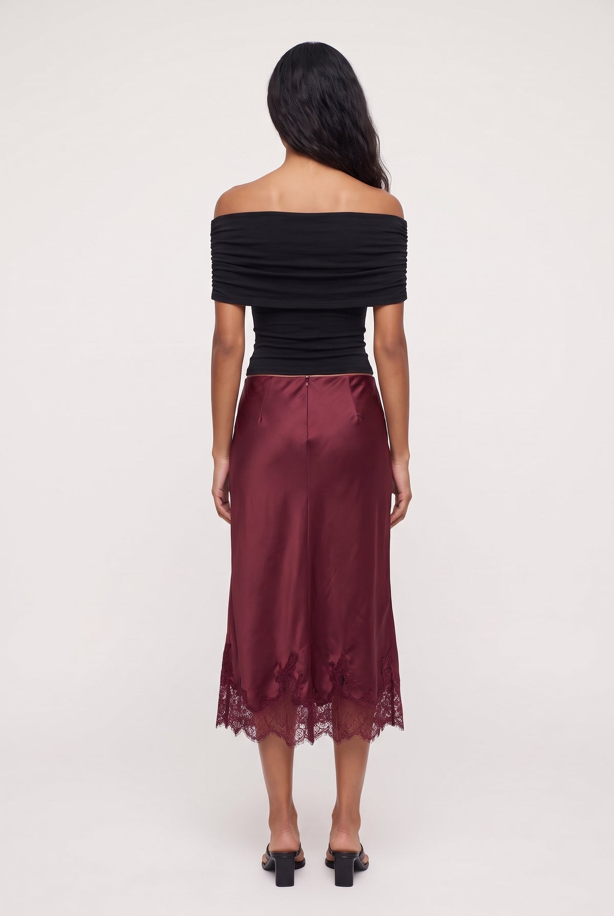 [BURGUNDY] model wearing LUCIA LACE SLIP SKIRT posing Back View