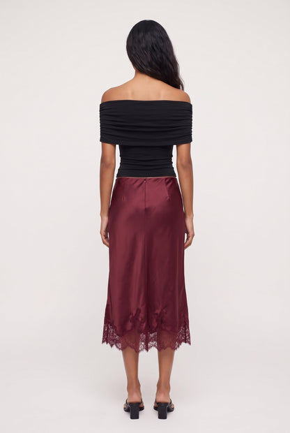
model wearing LUCIA LACE SLIP SKIRT posing Back View