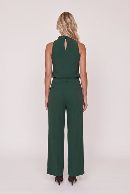 
model wearing Lili Pleated Trouser posing Back View