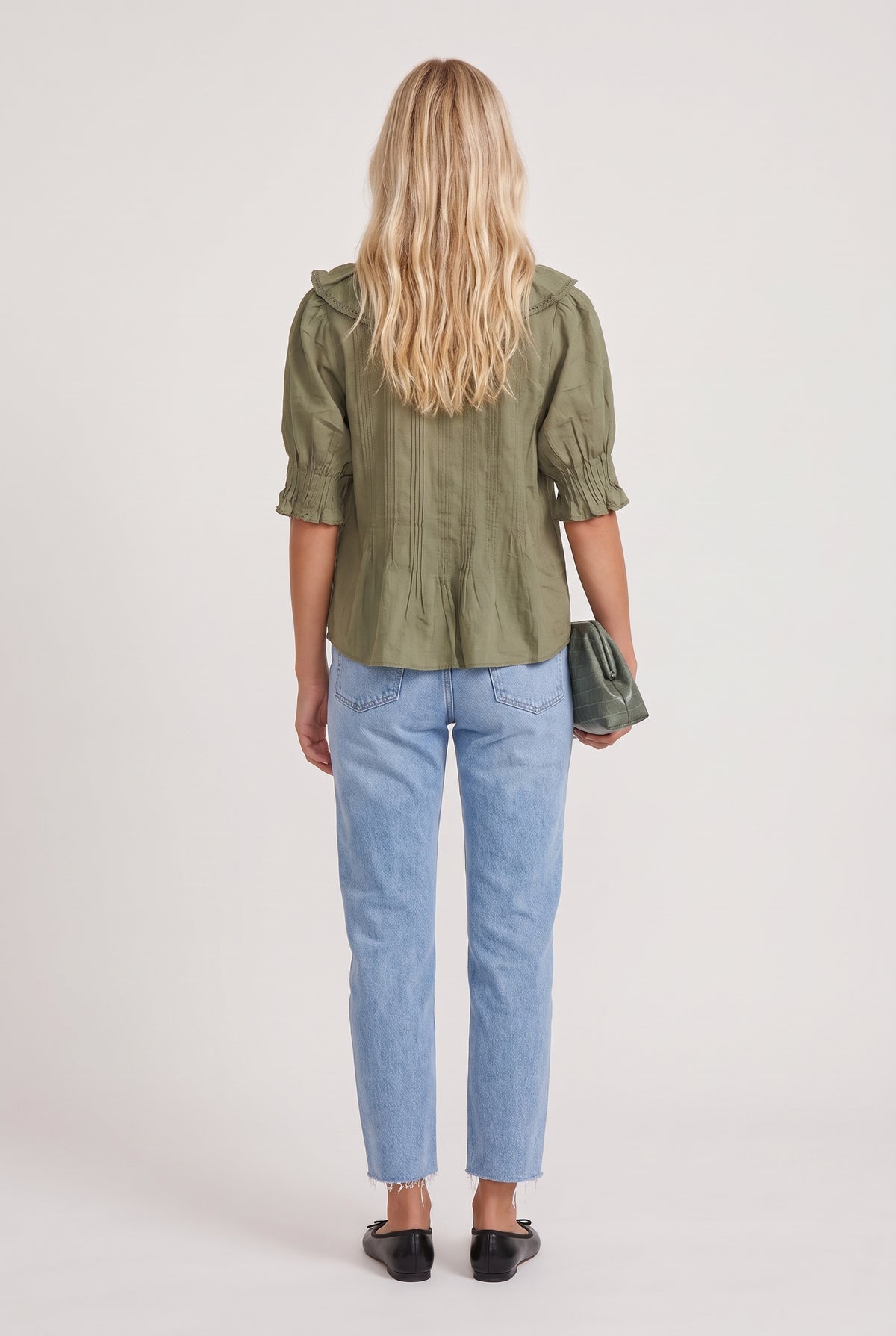 
model wearing Sage Ruffled Lace Trim Top posing Back View