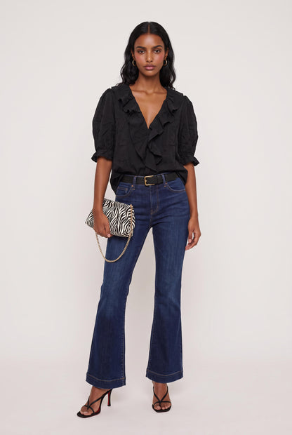 
model wearing Sage Ruffled Lace Trim Top posing Front View