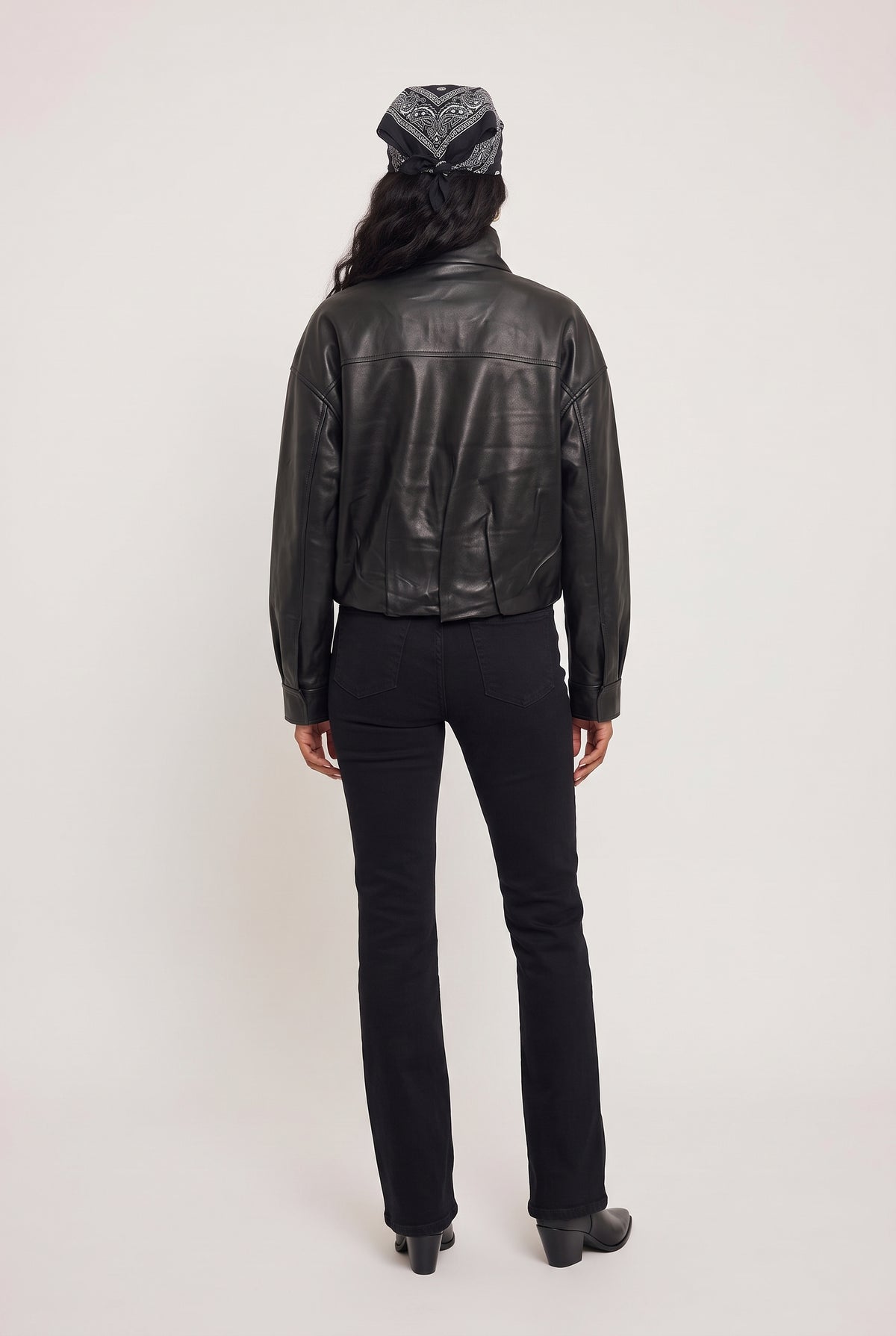 
model wearing Corin Bubble Hem Jacket posing Back View