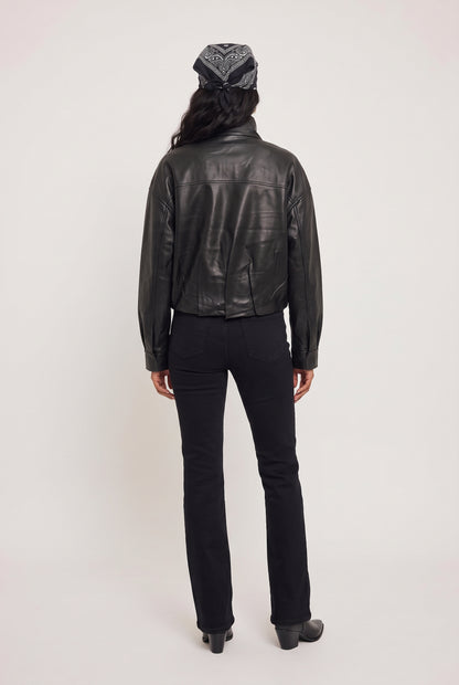 
model wearing Corin Bubble Hem Jacket posing Back View