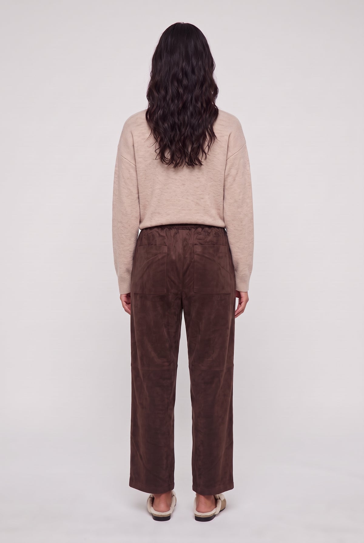 
model wearing Drift Suede Pant posing Back View