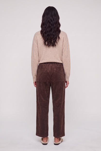 
model wearing Drift Suede Pant posing Back View