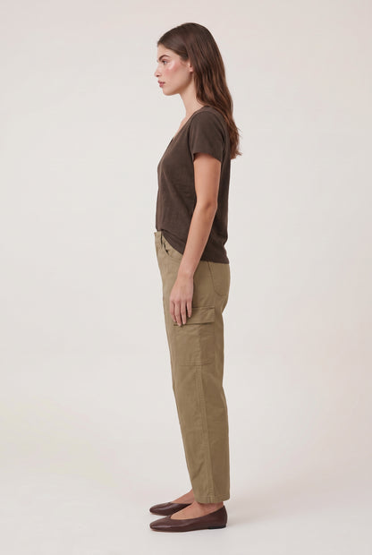 
model wearing Nomad V-neck Tee posing Side View
