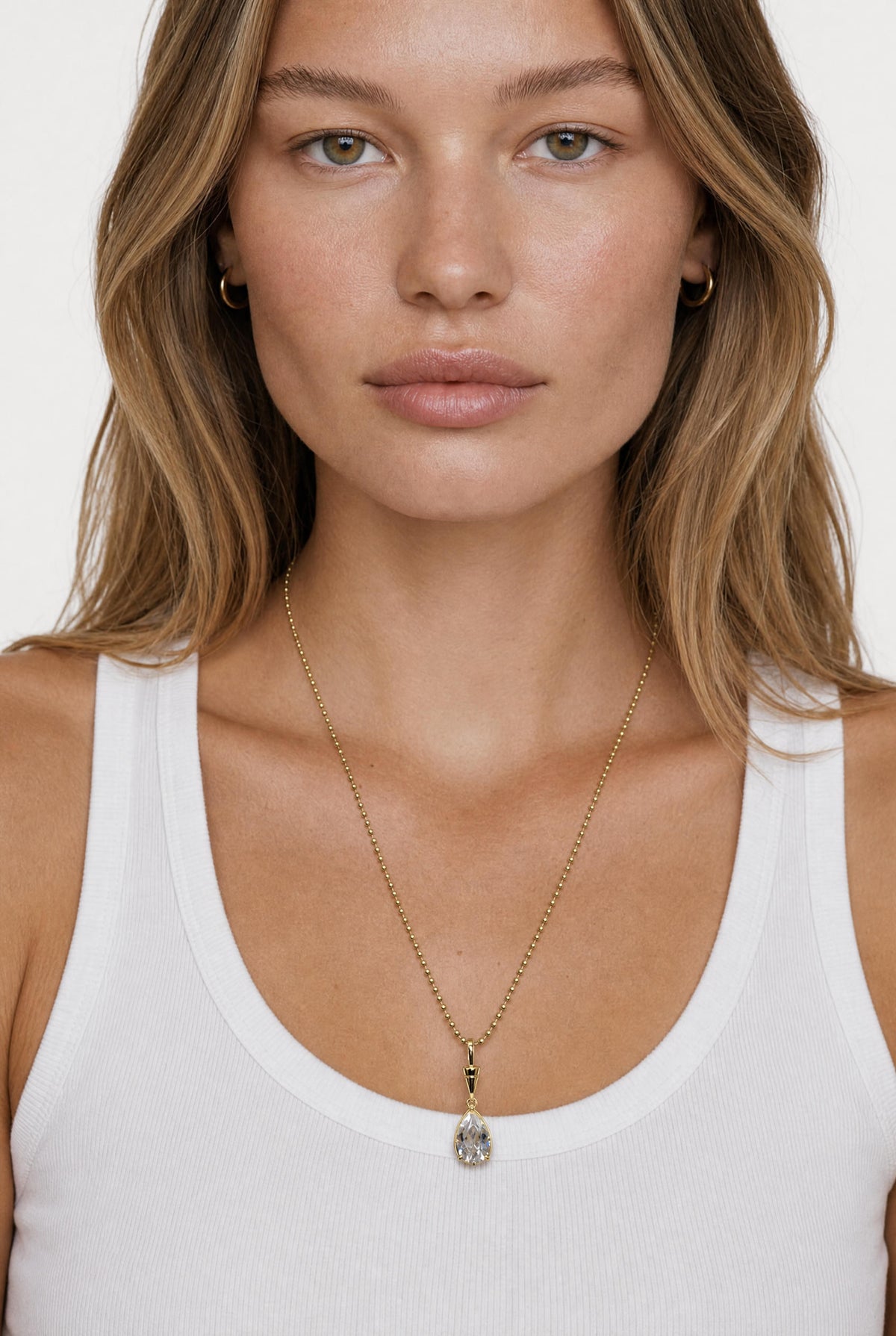 
model wearing Issa Bezel Charm On Ball Chain posing Front View