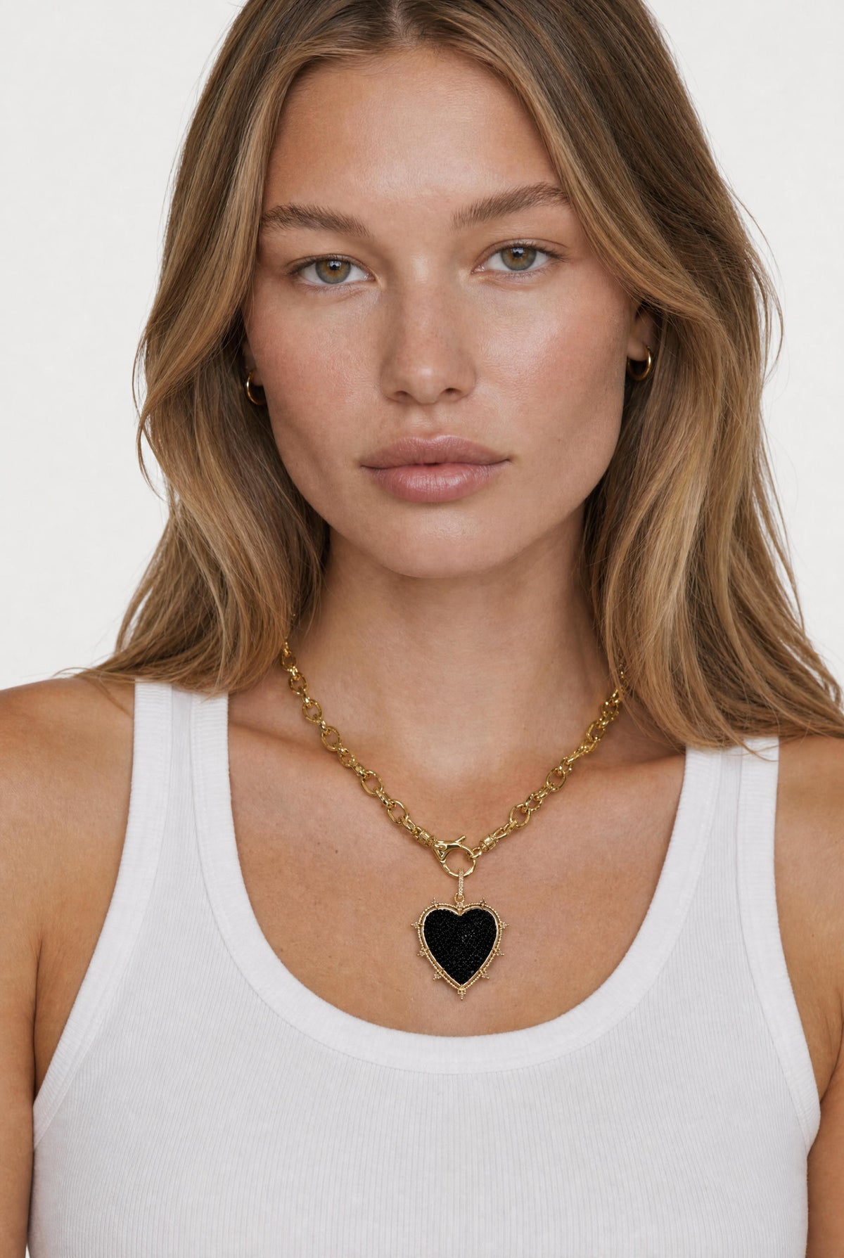 
model wearing Orion Cz Heart Necklace posing Front View
