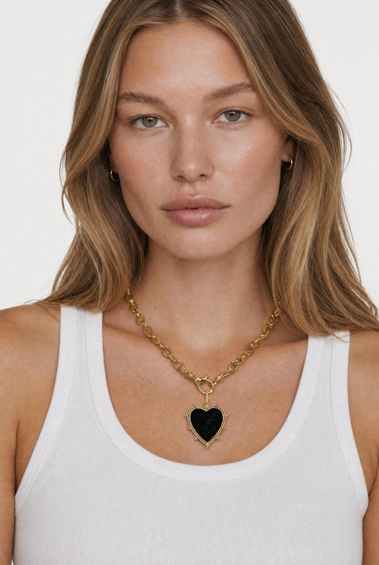 
model wearing Orion Cz Heart Necklace posing Front View