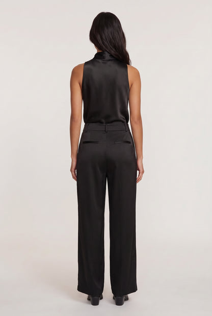 
model wearing Aman Satin Tank posing Back View