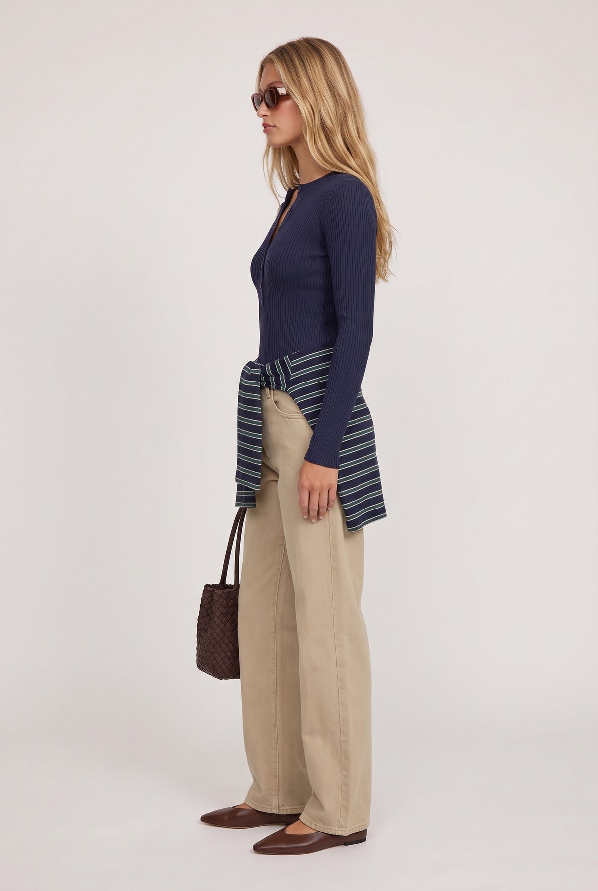 
model wearing Rowan Ribbed L/s Henley posing Side View