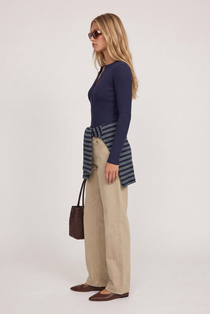 
model wearing Rowan Ribbed L/s Henley posing Side View