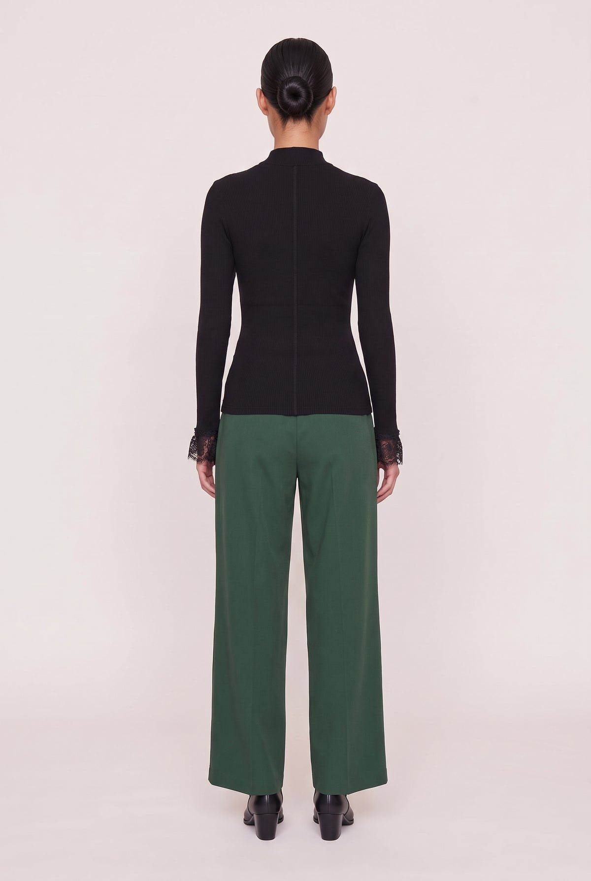 [BLACK] model wearing Cordelia L/s Turtleneck posing Back View
