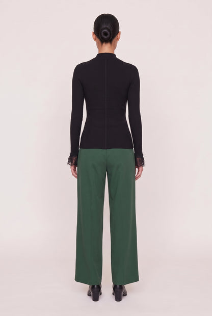 
model wearing Cordelia L/s Turtleneck posing Back View