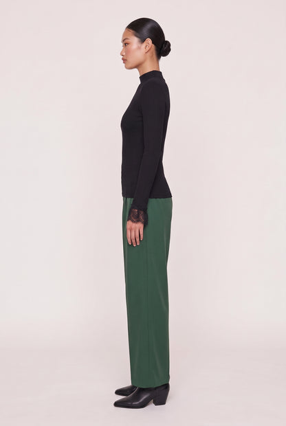 
model wearing Cordelia L/s Turtleneck posing Side View